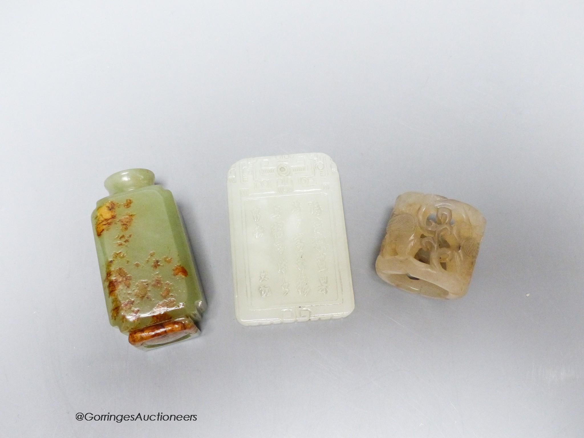 A Chinese jade archer's ring, snuff bottle and plaque, 2.7 - 6cm